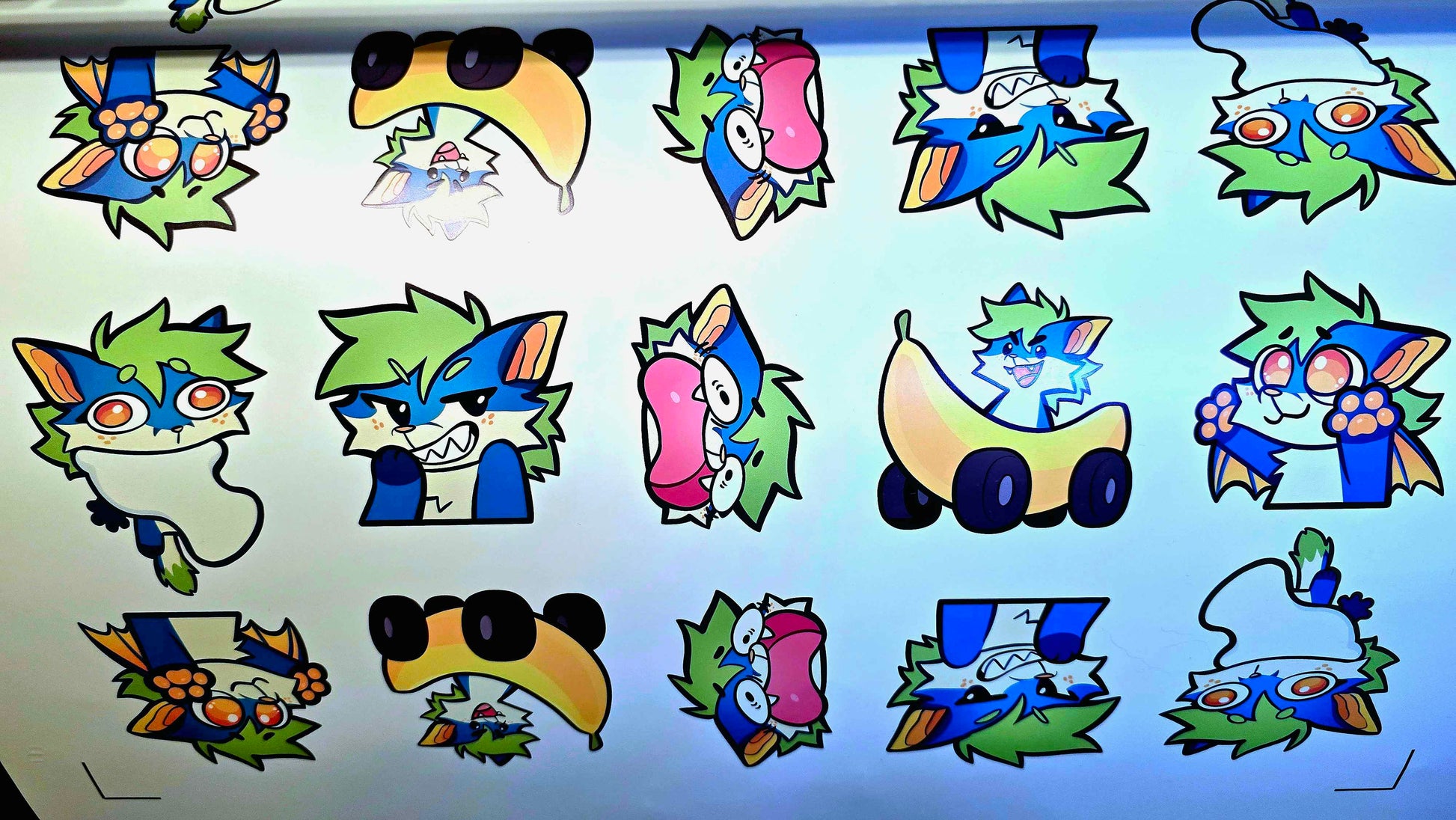 Collection of colorful cartoon character cutouts on a light background